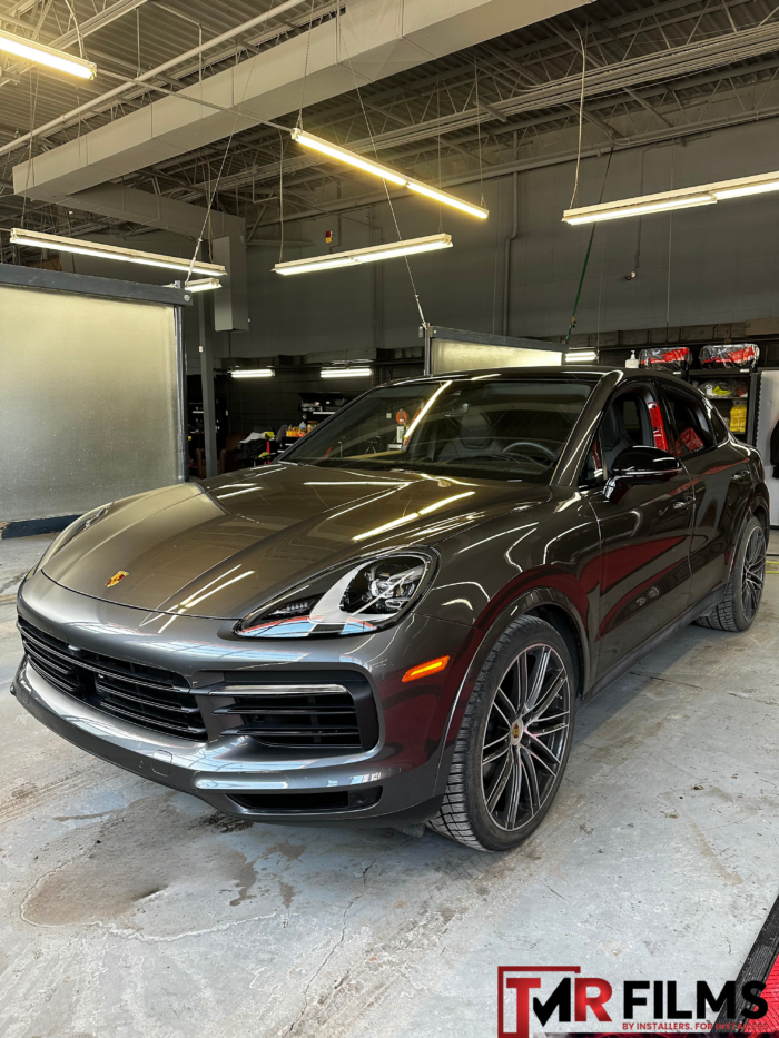 Grey Porsche with glossy paint protection film for enhanced shine and surface protection.